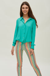 Bedrukte piquébroek met gesp aan de zoom